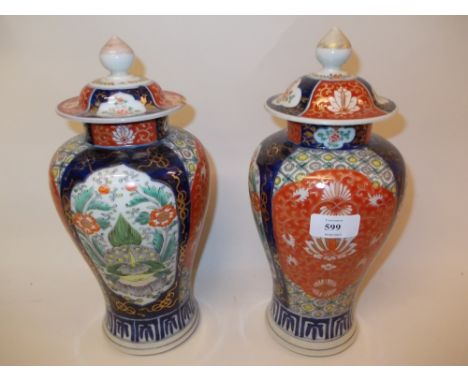 Pair of late 19th / early 20th Century Chinese baluster form vases and covers with enamel floral decorated panels and covers 