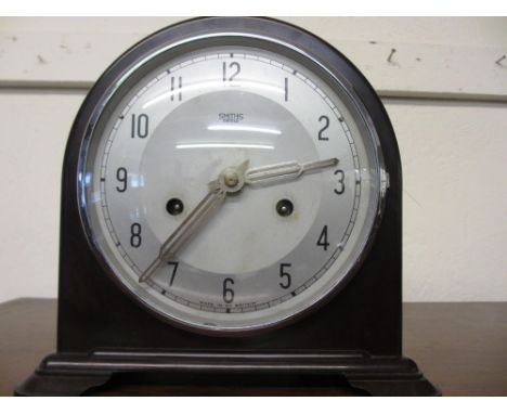 Mid 20th Century Smiths Bakelite mantel clock with silvered dial having Arabic numerals and two train movement striking on a 