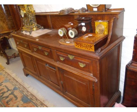 Mid 18th Century oak dresser, the low single shelf back above three drawers and two fielded panel doors flanking a fixed cent