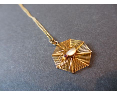 9ct Gold mother of pearl and ruby set spiders web pendant