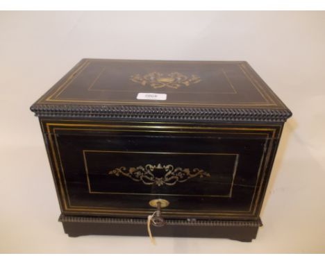 19th Century French ebony brass and mother of pearl inlaid liqueur cabinet, the hinged cover and front panel enclosing four d