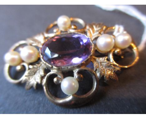 9ct Gold amethyst and cultured pearl set brooch of pierced floral design