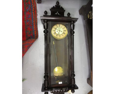 Large Vienna wall clock, the rectangular case with later dark stained finish, the enamel and paper dial with Roman numerals a