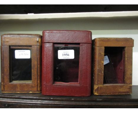 Group of three late 19th / early 20th Century leather cased travelling clock cases
