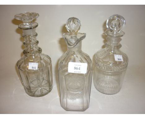 Georgian silver rum decanter with engraved floral and crescent moon decoration, together with two other Georgian cut glass de