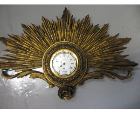 Edwardian gilt sunburst wall clock the circular enamel dial with Roman numerals and single train eight day movement, 40cms hi