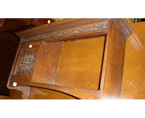 Arts and Crafts carved oak wall bracket with a single panel door beside an open shelf