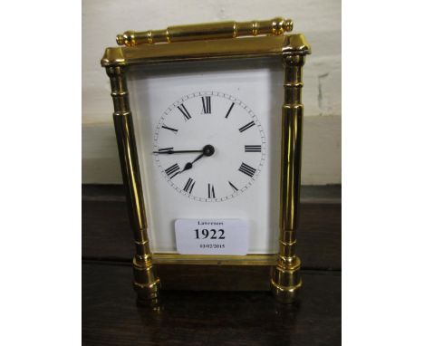 20th Century lacquered brass carriage clock, the enamel dial with Roman numerals and single train movement with key