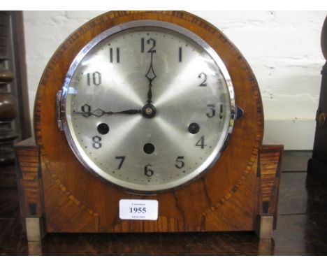 Art Deco walnut cased and inlaid dome top mantel clock having circular silvered dial with Arabic numerals and three train mov