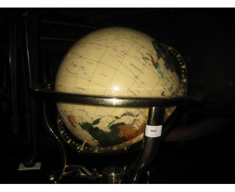 Large modern stone inset World globe on a polished brass stand with compass