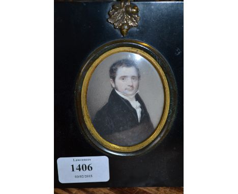 Early 19th Century English school, watercolour portrait miniature on ivory of a gentleman half length wearing a black coat an