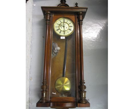 19th Century walnut cased Vienna style wall clock, the enamel dial with Roman numerals and two train movement