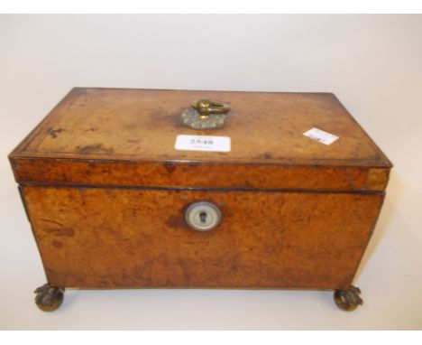 George III amboyna rectangular tea caddy, the hinged lid with original brass ring handle enclosing a three division interior 