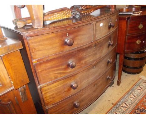 19th Century mahogany bow front chest of two short over three long drawers with knob handles raised on low bun supports