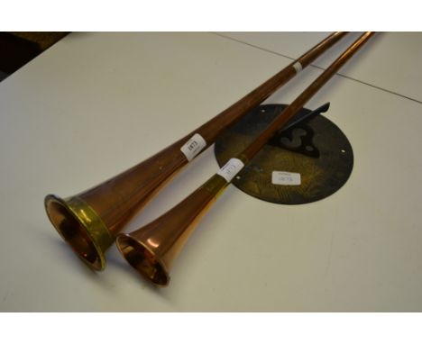 Two copper and brass post horns and a brass reproduction sundial fitting