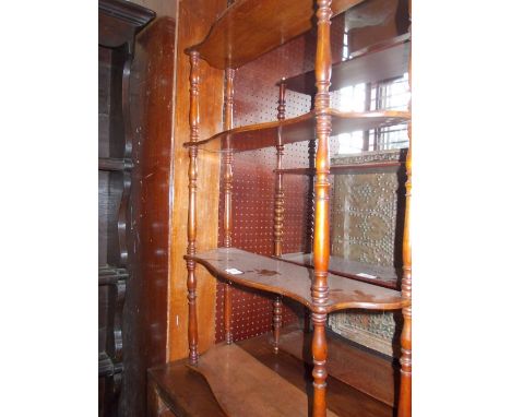 19th Century mahogany serpentine shaped four shelf hanging wall bracket on turned supports