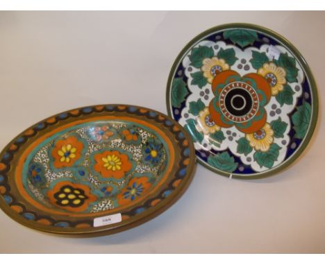 Rembrandt pottery bowl with stylised floral decoration on green and mottled ground, together with an Arras dish