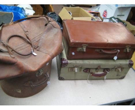 Early 20th Century leather cased circular hat box, leather holdall and two vintage suitcases