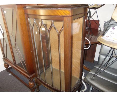 Small mahogany bow fronted display cabinet with a single bar glazed door raised on cabriole claw and ball supports