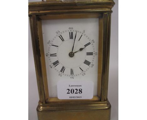 Late 19th / early 20th Century brass cased carriage clock, the enamel dial with Arabic and Roman numerals, the single train m