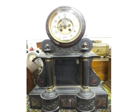 Large 19th Century black slate rouge marble and metal mounted mantel clock, the ceramic dial with Arabic numerals with a two 