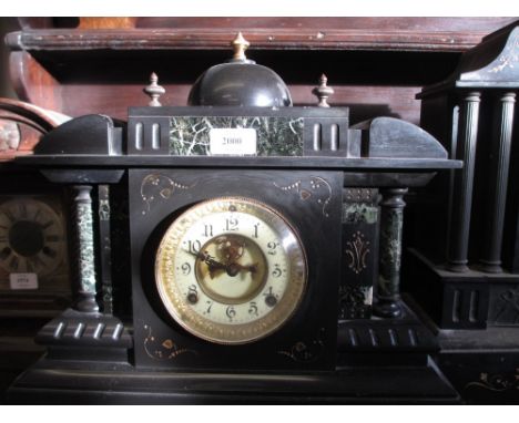 19th Century black slate mantel clock with a two train movement, the enamel dial with Arabic numerals and visible escapement