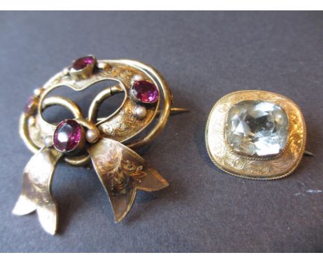 Victorian yellow metal bow form brooch set amethyst and seed pearls together with a small blue stone set brooch