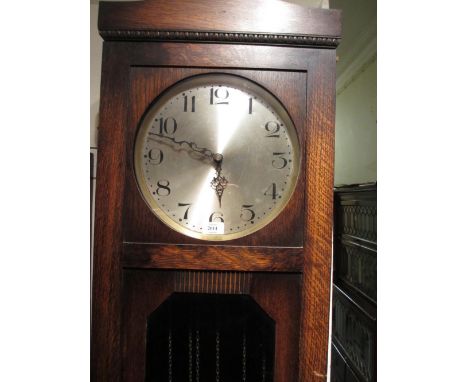 1930's Oak longcase clock with a circular silvered dial, Arabic numerals, and three train weight driven movement