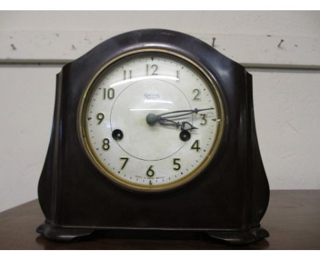 20th Century Smiths brown Bakelite mantel clock having circular silvered dial with Arabic numerals and two train movement str