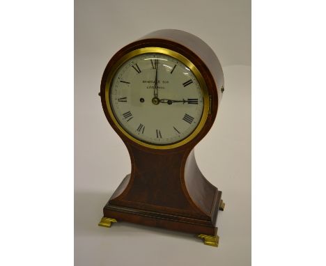 Large early 19th Century mahogany line inlaid and crossbanded balloon shaped mantel clock on cast brass ogee feet with circul