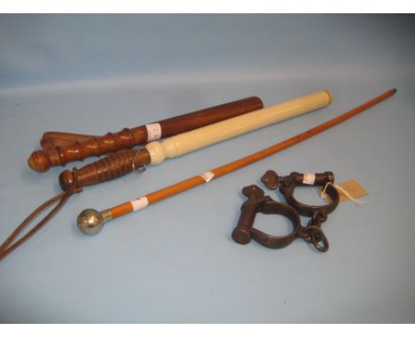 Military swagger stick, two truncheons and a pair of early handcuffs