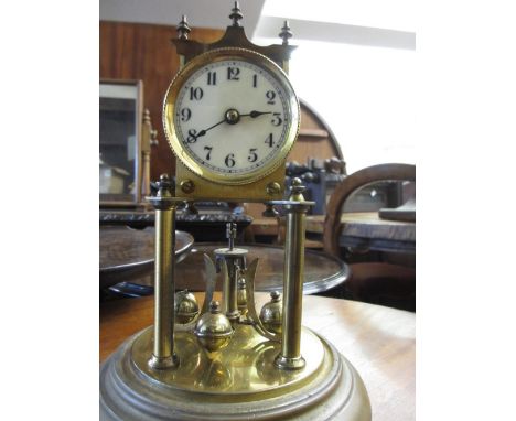 Early 20th Century brass three hundred day clock with enamel dial, Arabic numerals and original dome
