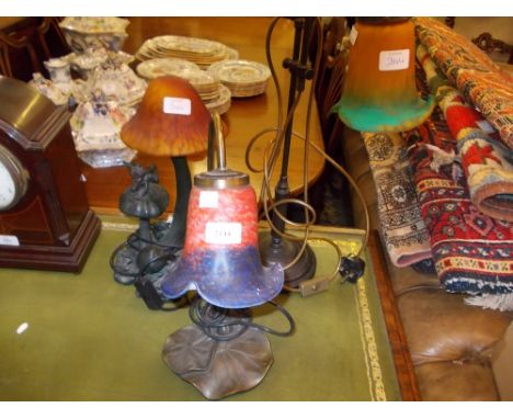 Group of three modern reproduction Art Nouveau style table lamps with coloured glass shades together with a 1930's etched gla