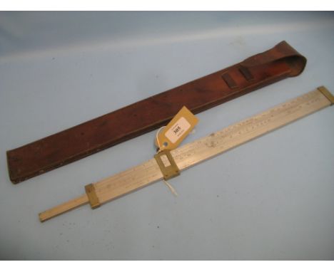 Aston and Mander Limited metal sliding rule, dated 1914 with M.O.D. arrow mark in a leather case