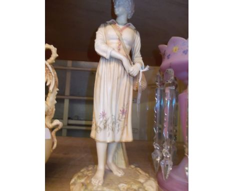 Large Hadley Worcester blush ivory figure of a standing girl carrying a wicker basket, 16.5ins high