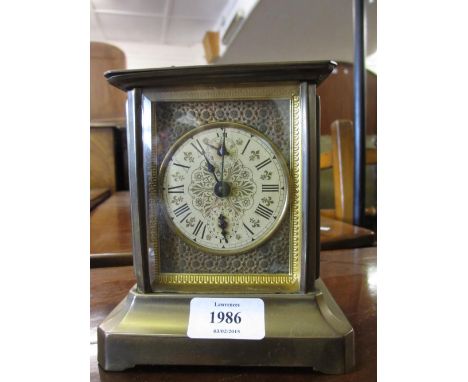 Late 19th or early 20th Century American metal cased mantel clock, the floral decorated dial with Roman numerals and subsidia