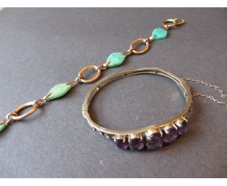 Edwardian amethyst and split pearl set bangle and a yellow metal and jade bracelet CONDITION REPORT Bangle is 52mm x 44mm
Som