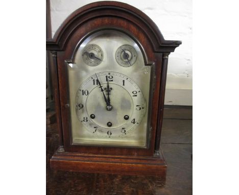 Edwardian mahogany bracket clock with broken arch case, the silvered dial with Arabic numerals, fast / slow and strike silent