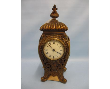 Mid 19th Century French gilt brass mantel clock, the pierced cast case with mask head decoration and circular enamel dial wit