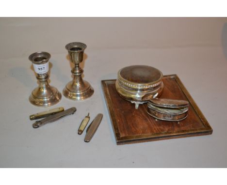Small rectangular silver photograph frame (a/f), pair of silver dwarf candlesticks, two trinket boxes and four pocket knives