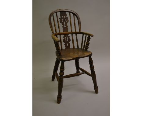 Late 18th or early 19th Century ash and elm Windsor type childs high chair, the hoop and stick back with pierced centre splat