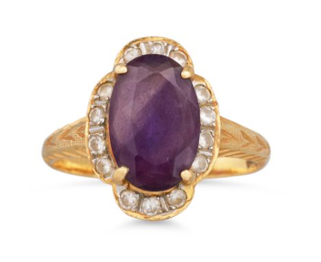 AN AMETHYST AND DIAMOND CLUSTER RING, mounted in 18ct yellow gold. Size: M - N