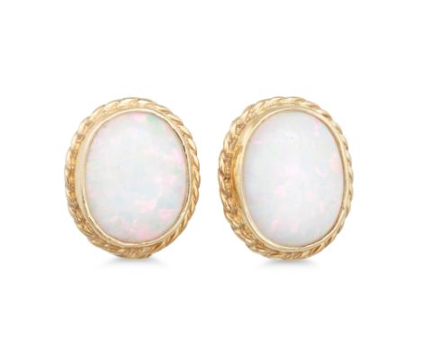 A PAIR OF OPAL EARRINGS, the oval opal to a gold surround