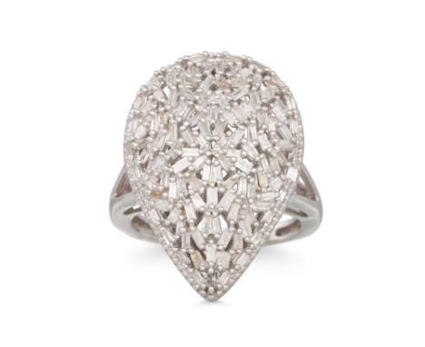 A DIAMOND DRESS RING, of shield shape, mounted in silver, size L