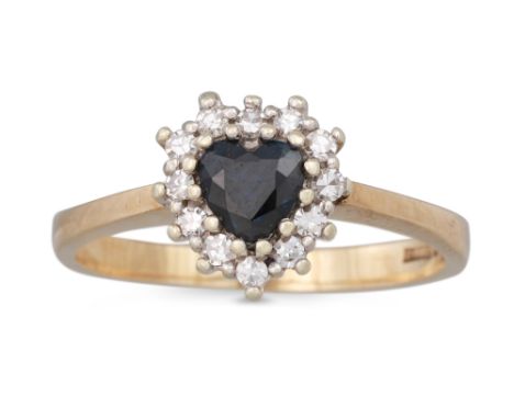 A SAPPHIRE AND DIAMOND CLUSTER RING, the heart shaped sapphire to diamond surround, mounted in yellow gold, size M