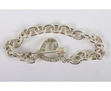 A Tiffany & Co silver heart and arrow link bracelet, the heart marked Tiffany & Co 1984 Italy, 27g
