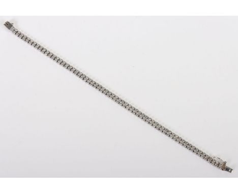 An 18ct white gold double line tennis bracelet, set with two rows of 2mm stones, 18cm, stamped 750, do not test as diamonds, 