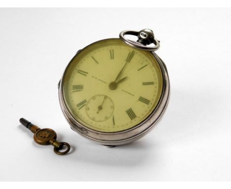 POCKET WATCH. An Edwardian open face silver pocket watch by H.E. Peck, London. The case hallmarked for Chester 1902. With key