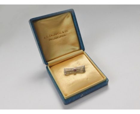 LACE PIN. An American white 10k. gold lace pin set a central amethyst in American (Philadelphia) presentation box.  Please no