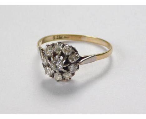 DIAMOND RING. An 18ct. gold & platinum diamond set cluster ring, the central stone of approx. 0.30ct. spread. Approx. 2.7g. S